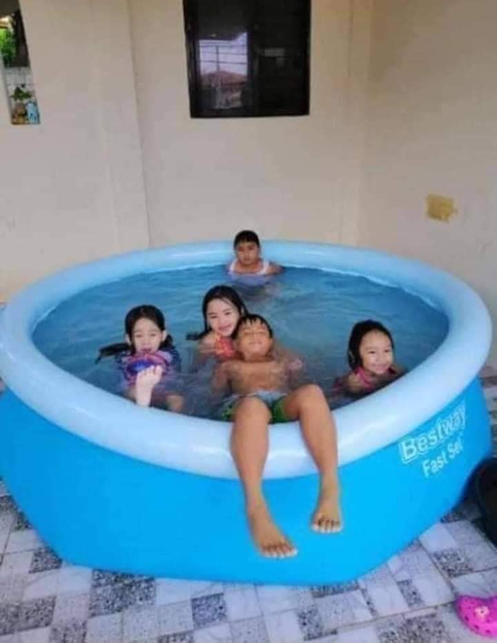 Round pool with portable inflatable structure, designed for outdoor family use with durable and spacious layout