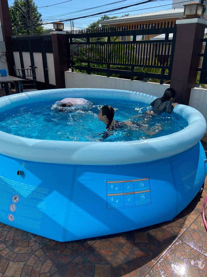 Inflatable circular pool for backyard setup, portable and lightweight design for kids and adult water fun