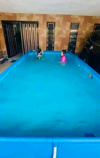 Outdoor rectangular pool with portable structure, strong frame design for family summer water activities