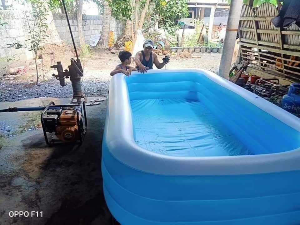 Blue inflatable family pool with large capacity for outdoor use, sturdy rectangular design with reinforced side walls